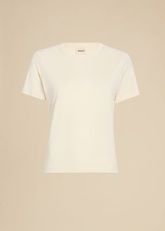 Description Debuting in soft and slinky matte viscose crepe jersey for Pre-Fall 2023, this crewneck tee combines clean lines with sporty ease. The classic silhouette, designed for a slightly shrunken fit, is refined by finishing at the neckline and a versatile matte finish. Details Material: Stretch crepe viscose (100% viscose) Care: Dry clean Fit: True to size. Recommended to take your normal size. Model is 5'10," wearing size S. Solid Color Scoop Neck T-shirt With Minimal Stretch, Fitted Crew Neck T-shirt For Loungewear, Spring Crew Neck T-shirt With Minimal Stretch, Summer Jersey Crew Neck Top, Pre Fall 2023, Stretch Crepe, Fall 2023, Classic Silhouette, Pre Fall