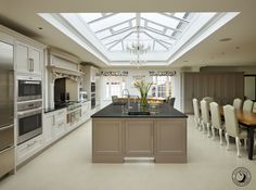 a large kitchen with an island in the middle