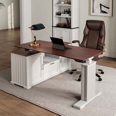 an office desk with a laptop on it