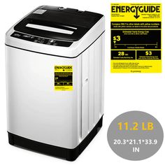 a white washing machine sitting next to a yellow and black sign that says energycude