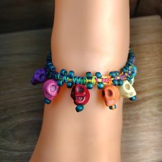 Elevate your jewelry collection with our handmade dangle hemp anklet with skull beads! Made with high-quality 0.5mm rainbow hemp, turquoise skull beads, and round Miyuki beads, this anklet is sure to add a unique touch to any outfit. At 10.5 inches in length and 2cm wide, it's the perfect size for most ankles. The dangle design brings movement and flair, while the skull beads add a hint of edginess. Handcrafted with care and attention to detail, this anklet is a one-of-a-kind piece that you won't find anywhere else. Don't miss out on this stylish accessory - shop now and make a statement with our hemp anklet! Multicolor Bohemian Skull Jewelry, Handmade Adjustable Skull Jewelry, Skull Bead Jewelry, Hemp Anklet, Boho Hippie Style, Skull Beads, Beaded Skull, The Skull, Miyuki Beads