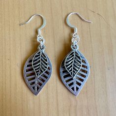 Nature is always in style when you've got these layered leaves on your lobes.  - 2" long - Nickel free ear wires - silver plated charms - comfortable for all day wear. Find more of my earrings here: https://www.etsy.com/shop/fatcatbeads?section_id=42122010 Thank you for shopping with me! View all of my items here: www.fatcatbeads.etsy.com Nickel-free Leaf-shaped Nature-inspired Earrings, Nickel-free Metal Leaf Earrings, Nickel-free Leaf-shaped Sterling Silver Earrings, Nature-inspired Hypoallergenic Leaf Earrings, Nickel Free Leaf-shaped Metal Earrings, Nature-inspired Silver Metal Earrings, Nickel-free Leaf-shaped Metal Earrings, Silver Nature-inspired Metal Earrings, Nickel-free Metal Leaf-shaped Earrings