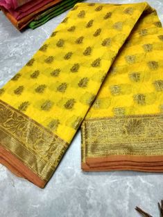 This Beautiful Banarasi silk  Saree have following details Product Detail:  Design Details: Banarasi Kota silk  saree With Blouse Piece. Size & Fit: Length: 5.5 meters plus 0.8 Meter blouse piece Width: 1.06 meters (approx) Saree Weight : 0.650 gms Material and care: Saree Type : Banarasi Saree Fabric:  silk Blouse Fabric: Silk  Blouse Type: (Without Stitch and Stitch) Dry-clean first time there after machine wash or hand wash. Shipping:- We ship goods worldwide within 1 to 3 business days of order confirmation and delivery time is 6 to 7 days. In case of sewing the blouse, you will have to wait 3 more working days.  Occasion: Party Wear, Formal Wear, Festival Wear , Marrige Function Wear, Casual Wear, Regular Use.  Note: Disclaimer : The color of actual product may vary slightly from the Yellow Semi-stitched Chanderi Pre-draped Saree, Yellow Semi-stitched Cotton Silk Saree, Traditional Yellow Paithani Silk Pre-draped Saree, Yellow Tussar Silk Pre-draped Saree For Diwali, Yellow Handloom Pre-draped Saree For Navratri, Yellow Handloom Pre-draped Saree For Wedding, Festive Yellow Tussar Silk Pre-draped Saree, Festive Yellow Paithani Silk Pre-draped Saree, Yellow Pre-draped Saree For Festivals