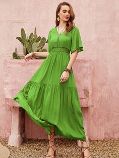 Lace Ruffle A-Line Dress: A Solid Contrast for Your Wardrobe Casual Green Dress With Lace Patchwork, Short Sleeve Lace Maxi Dress With Ruffles, Flowy Green Dress With Lace Trim, Green Flowy Dress With Lace Trim, Lace Maxi Dress With Ruffles And Short Sleeves, Green Maxi Dress With Lace Trim For Spring, Casual Lace Maxi Dress With Ruffles, Spring Tiered Maxi Dress With Lace Trim, Solid Color Short Sleeve Dress With Lace Trim