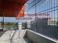 an empty balcony with metal bars on the sides