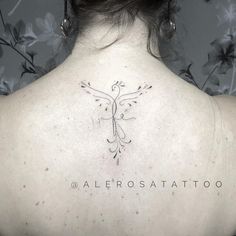 a woman with a tattoo on her back