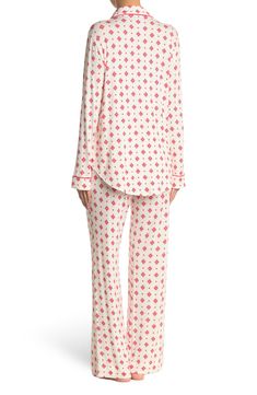 A soft jersey knit pajama set with a pretty print delivers feminine style and essential comfort. 2-piece set Shirt: 25" length (size S); Pants: 9.5" rise, 32" inseam (size S) Shirt: notch lapel, long sleeves, front button closures, chest patch pocket, allover print, contrast piping, knit construction Pants: elasticized waist, pull-on style, allover print, knit construction 95% rayon, 5% spandex Machine wash cold Imported Model’s stats for sizing: 5’11” height, 32” bust, 24” waist, 34” hips. Mode Printed Relaxed Fit Tops For Pajama Party, Casual Printed Long Sleeve Sleepwear, Casual Long Sleeve Printed Sleepwear, White Printed Long Sleeve Sleepwear, Casual Fitted Sleepwear For Bedtime, Fitted Casual Sleepwear For Bedtime, Long Sleeve Printed Loungewear Sets, Long Sleeve Printed Lounging Sets, Printed Long Sleeve Lounging Sets