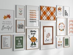 there are many framed pictures on the wall with words and symbols in them, including pumpkins