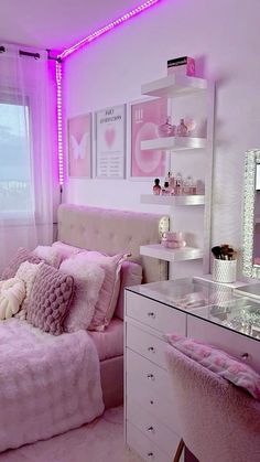 a bedroom with pink lighting and white furniture