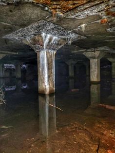 the inside of an abandoned building with water in it