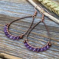 Faceted Amethyst Earrings wrapped with Copper Wire and includes a Nickel Free Ear-Wire: These earrings are light weight, comfortable, simple and fun. Throw them on with any outfit and they will definitely add some pop and sparkle! They are approximately 2.25 inches in length and 1.15 inches at the widest portion. If you would like these in a different color or size, please let me know as I also do customized orders. To view more of my original jewelry designs, visit: https://www.etsy.com/shop/Th Rustic Wedding Jewelry, Wire Wrapped Gemstone Jewelry, February Birthstone Jewelry, Wire Wrapped Stone Jewelry, Original Jewelry Design, Natural Stone Earrings, Basic Jewelry, Earrings Bohemian, Stylish Earring