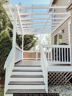 a white pergolan on the side of a house with steps leading up to it