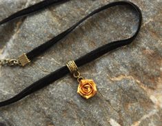 "Skinny velvet ribbon choker with sculpted gold metallic rose. Rose material is polymer clay with special strong metallic cover. Each petal of flower made by hand without any mold Dia flower about 12 mm/ 0.4 \" Length of necklace is adjustable: 10-12 inches/ 25,4 - 30,5 cm 11-13 inches/ 28-33 cm 12-14 inches/ 30.5- 35.5 cm 13-15 inches/ 33-38 cm 14-16 inches/ 35.5 cm-40.5 cm 15-17 inches/ 38,1 cm- 43,2 cm 16-18 inches/ 40.6 cm- 45.7 cm 17-19 inches/ 43 cm - 48 cm 18-20 inches/ 40,5- 50,8 cm Widt Adjustable Rose Gold Choker For Party, Adjustable Rose Gold Party Choker, Adjustable Gold Rose Design Jewelry, Rose Design Choker Necklace, Adjustable Rose Choker Necklace, Adjustable Rose Gold Choker, Gift Rose Design Choker In Rose Color, Adjustable Rose Design Choker Necklace, Rose Design Choker Jewelry Gift