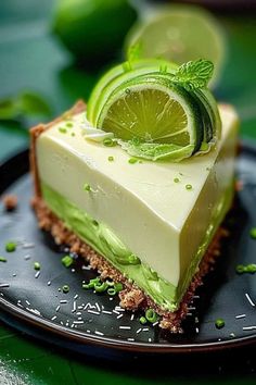 a slice of lime pie on a black plate