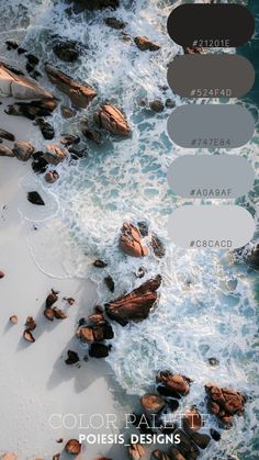 an aerial view of the ocean with some rocks and water in color pallets on it