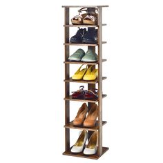 a wooden shoe rack with several pairs of shoes