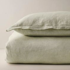 two pillows sitting on top of each other