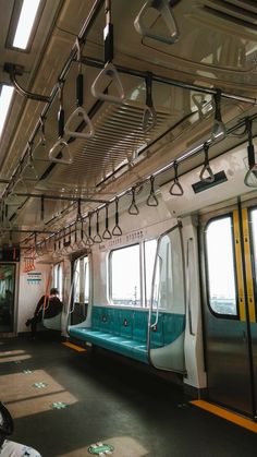 the inside of a subway car with lots of windows