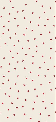 a white and red wallpaper with small hearts on it's backgroun