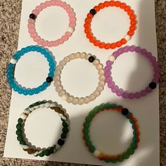 7 Limited Edition Lokai Bracelets. Size Medium. White Beaded Bracelets For Everyday, Casual Multicolor Jewelry For Everyday, Casual Multicolor Everyday Jewelry, White Stackable Beaded Bracelets For Everyday, White Wristband For Everyday Use, Casual White Bracelets For Friendship, Everyday Hypoallergenic White Bracelets, Everyday White Beaded Wristband, Casual White Bracelets For Everyday Wear