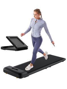 a woman is running on a treadmill with an electronic device in front of her