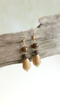 "Small teardrop wood earrings are dangling from stainless steel gold plated french wires hooks . The colors are light green teardrop and  brown  . Cute  pair of wood earrings - for earthy women ! Size : 1 \"  3/4 '  long             7 mm diameter" Teardrop Wooden Earrings For Gifts, Wooden Teardrop Earrings For Gift, Teardrop Wood Earrings For Gifts, Brown Teardrop Wood Jewelry, Wooden Teardrop Earrings As Gift, Teardrop Wood Jewelry Gift, Brown Wooden Bead Drop Earrings, Handmade Brown Teardrop Dangle Earrings, Brown Wooden Drop Earrings