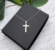 "This is a beautiful shiny small double sided minimalist stainless steel 22 mm cross necklace.  The cross measures 7/8 inch without bail and 1 inch with bail. Additional stainless steel cross necklaces in my shop: https://www.etsy.com/shop/AlwaysPrettyThings?ref=seller-platfosgrm-mcnav&search_query=stainless+steel+cross See all my stainless steel necklaces: https://www.etsy.com/shop/AlwaysPrettyThings?ref=seller-platform-mcnav§ion_id=21348272 Stainless steel is a darker metal than the bright ste Minimalist Cross Pendant Necklace For Gift, Minimalist Cross Necklace Gift, Stainless Steel Cross Pendant Necklace As Gift, Stainless Steel Crucifix Cross Necklace As Gift, Stainless Steel Cross Pendant Necklace For Gift, Minimalist Nickel-free Cross Necklace, Minimalist Stainless Steel Cross Pendant Jewelry, Adjustable Stainless Steel Cross Necklace, Gift Stainless Steel Cross Pendant Necklace