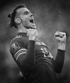 a soccer player with his mouth open in the rain