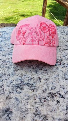 a pink hat sitting on top of a table