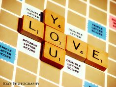 the word love spelled with scrabble tiles