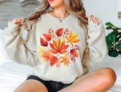 Autumn Shirt Fall Leaf Sweatshirt Fallen leaves Shirt Plant Women Thanksgiving Gift Fall Sweatshirt Autumn Leaves Shirt Botanical Sweatshirt 💛Related Items💛 🫧Halloween Spooky Season Sweatshirt https://www.etsy.com/listing/1520663991/halloween-shirt-spooky-sweatshirt 🫧Retro Pumpkin Season Sweatshirt https://www.etsy.com/listing/1507337752/pumpkin-shirt-halloween-sweatshirt-women 🫧Gnome Halloween Sweatshirt https://www.etsy.com/listing/1507397430/gnome-halloween-shirt-pumpkin-sweatshirt 🫧Halloween Customized Pooh Sweatshirt https://www.etsy.com/listing/1520176907/custom-halloween-shirt-pooh-sweatshirt ❤️ 50% Cotton 50% Polyester: Made by specially spinned fibers that make very strong and smooth fabric. Polyester fibers are extremely strong, resistant to most chemicals, stretching and s Leaves Shirt, Gnome Halloween, Spooky Sweatshirt, Pumpkin Sweatshirt, Pumpkin Sweatshirts, Fallen Leaves, Pumpkin Season, Fall Leaf, Sweatshirt Women