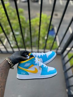 Custom St.Lucia Themed Air Jordan 1s. This price includes purchasing the sneakers. All Adult sizes are for both Men and Women. All prices are USD. Color Shade of shoe may vary on screen versus in person and under different lighting. All shoes are Made to Order and turnaround for completion is 4-6 weeks per shoe. Custom Made Jordans, Custom Jordan Shoes, Jordan Shoes For Men, Air Jordan 1s, Jordan 1s, Basketball Teams, St Lucia, Color Shades, Air Jordan 1