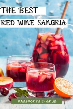 three glasses filled with sangria on top of a table next to sliced oranges