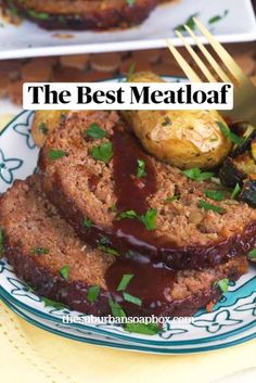 meatloaf on a plate with potatoes and gravy next to a fork