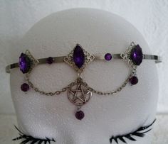 This beautiful circlet has three sterling silver plated filigree accents with purple faceted glass settings, purple faceted bead drops, rhinestones, pewter silver pentacle and metal chain. Adjustable. Forehead Jewelry, Wicca Jewelry, Marvel Dr, New Plymouth, Wiccan Jewelry, Pagan Jewelry, Witch Aesthetic, Faceted Glass, Faceted Bead