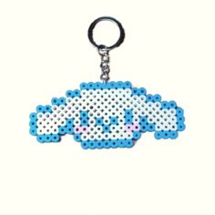 a keychain with an image of a cloud on it's front and back sides