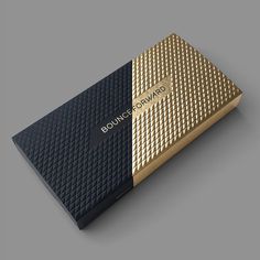 a black and gold box with the word boucycourts on it