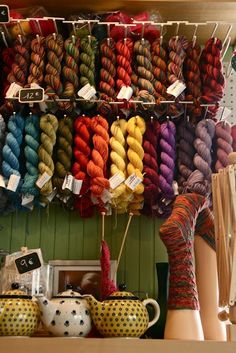 there are many skeins of yarn on display