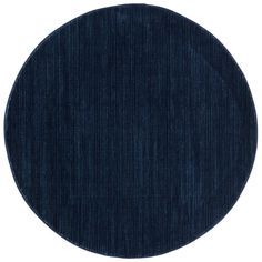 a round rug with dark blue stripes on it