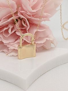 Our gift to you 10% off your first purchase. Details here - http:/eepurl.com/dpVPBzOur love lock necklaces are perfect stand alone or layering pieces. Locks are suspended on our signature gold fill chain.Lots of love and symbolism in these pieces. They make thoughtful gifts or that something special for yourself!....................DETAILS14 k fill chain and components18 k gold fill charm high shine finishThis listing is for one tiny lock necklace onlyCharm is approximately 1/2"wide by 3/4" high Everyday Locket Pendant Charm Necklace, Minimalist Jewelry With Lock As A Gift, Minimalist Lock Jewelry As A Gift, Minimalist Lock Jewelry As Gift, Minimalist Everyday Jewelry With Lock Detail, Minimalist Lock Jewelry For Gifts, Elegant Necklace With Lock Detail As Gift, Elegant Necklace With Lock Detail For Gift, Everyday Gold Jewelry With Lock Detail