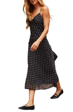 Peppy polka dots amplify the everyday charm of this light and airy chiffon slipdress topped with a drapey cowl neckline. Ties at back Cowl neck Adjustable straps Lined 100% polyester Hand wash, line dry Imported Chic Summer Maxi Dress With Cowl Neck, Chic Cowl Neck Maxi Dress For Summer, Flowy Polka Dot Midi Dress, Elegant Flowy Polka Dot Dress, Chic Flowy Polka Dot Dress, Casual Polka Dot Chiffon Dresses, Vici Collection, Floral Print Midi Dress, Cowl Neckline