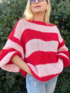 Pink and Red Striped Sweater - Cozy, Chic, and Vibrant Embrace the perfect blend of comfort and style with our Pink and Red Striped Mohair Sweater. Designed to add a pop of color to your wardrobe, this handknit mohair sweater is your go-to choice for chilly days and cozy nights. Whether you're heading out for a casual day with friends or lounging at home, this vibrant piece ensures you stay warm and fashionable. Key Features: - Vibrant Stripes: The eye-catching pink and red stripes make a bold s Casual Red Mohair Sweater, Cozy Red Crew Neck Sweater, Red Soft Knit Sweater, Red Oversized Knitted Sweater, Cozy Red Soft Knit Top, Red Soft Knit Crew Neck Sweater, Oversized Red Knitted Sweater, Red Oversized Soft Knit Sweater, Red Hand Knitted Long Sleeve Sweater