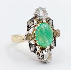 French antique marquise ring 18k gold set with a 2.24 carat emerald cabochon surrounded by table and rose cut diamonds (circa 1900)  Magnificent and rare work of an antique goldsmith  Size: 52 FR / 6 US  Weight: 6.20 g  Emerald size: approximately 10 x 7.5 x 4 mm (estimated at 2.24 carats) Table cut diamond size: approximately 4.5 x 4 mm  Head size: 22 x 15 mm  ATTENTION: table cut diamonds have chips, the emerald cabochon have small surface scratches Owl punches (French punches) Visit my shop f Vintage Green Emerald Ring With Rose Cut Diamonds, Vintage Cabochon Emerald Ring For Wedding, Victorian Rose Cut Oval Cabochon Jewelry, Antique Emerald Ring Oval Cabochon, Antique Cabochon Emerald Wedding Ring, Antique Oval Cabochon Emerald Ring, Antique Emerald Ring With Oval Cabochon, Vintage Green Marquise Emerald Ring, Heirloom Oval Emerald Ring With Rose Cut Diamonds