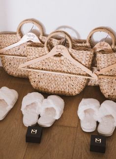 the baby's shoes are laid out on the floor next to their mother's basket