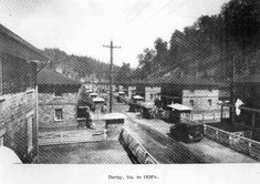 an old black and white photo of a town