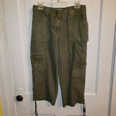 Nwt- New, Never Worn Beautiful Capri Pants Featuring Belt Loops And Drawstring, Zip And Button Fly, Two Back Pockets With Button Down Flap, Hand Pockets, Pockets On Each Leg With Button Down Flap, Small Zip Pocket Above Pocket On Right Leg, And Drawstring On Side Of Each Leg For Shirring. Pants Are Very Unique. 70% Rayon 30% Polyester Mid-rise Cargo Pants With Button Closure For Spring, Spring Khaki Capris With Pockets, Casual Capris With Button Closure, Capri Length Pants With Pockets For Work, Casual Cotton Capri Cargo Pants, Spring Casual Cargo Capri Pants, Spring Casual Capri Length Cargo Pants, Spring Casual Capri-length Cargo Pants, Cotton Cargo Capri Bottoms