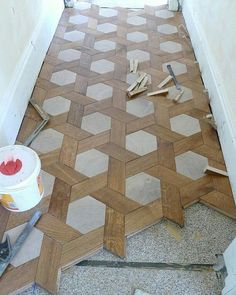 the floor is being laid out and ready to be painted with wood planks on it