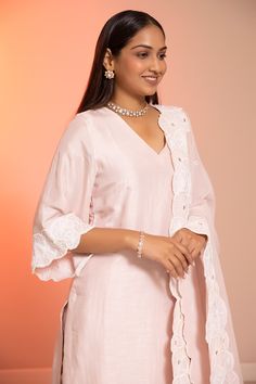 Blush cotton silk straight kurta with sequins and cutdana applique embroidered hem and cuffs. Comes with pant and a dupatta.
Components: 3
Pattern: Applique embroidered
Type Of Work: Sequins, Cutdana
Neckline: V Neck
Sleeve Type: Three quarter
Fabric: Cotton silk
Color: Pink
Other Details: 
Embroidered borders on dupatta
Attached lining
Note : Kindly contact customer service for customizations in dupatta.
Occasion: Mehendi and Haldi - Aza Fashions Kurta Pant Set, Embroidered Hem, Straight Kurta, Kurta With Pants, Fashion App, Pant Set, Pink Cotton, Set For Women, Cotton Silk