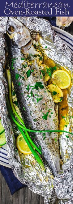 grilled fish in foil with lemons and green onions