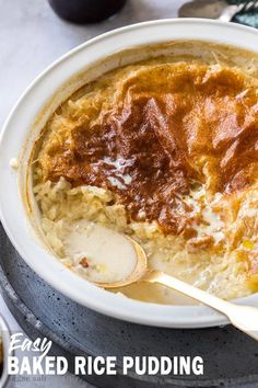 a bowl of baked rice pudding with a spoon in it